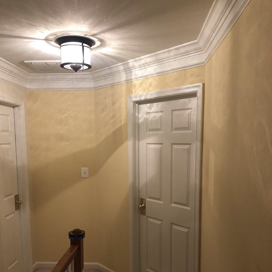 Freshly painted walls and ceiling using professional tools