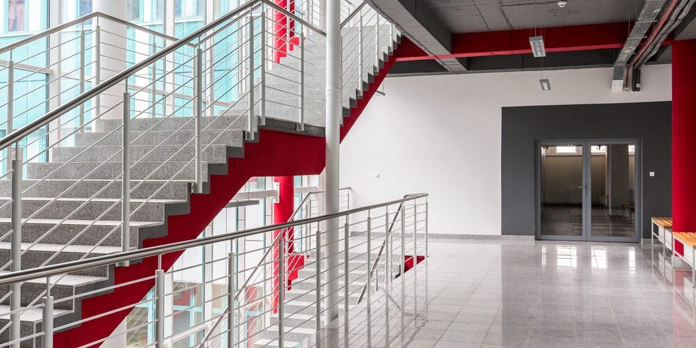 Modern,,Light,Staircase,With,Silver,Railing,,Red,Details,And,Black