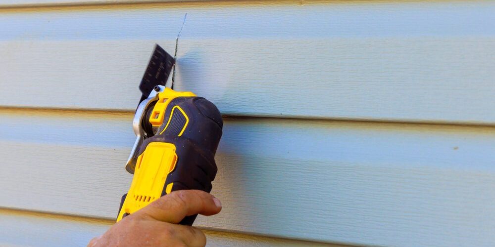 Replacement of exterior plastic siding on wall of house