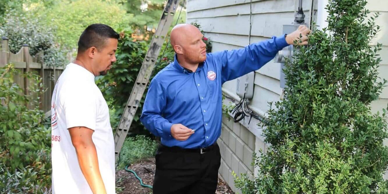all american painting plus team member conducting an expert home exterior painting estimate