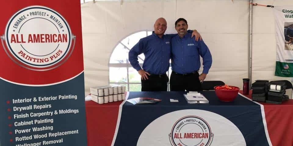 All American Painting Plus employees at booth